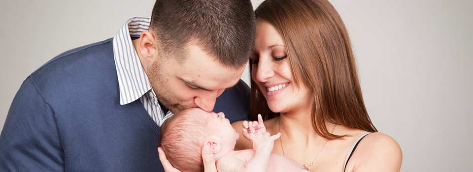 young couple with newborn baby
