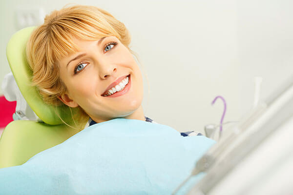 woman in dental chair preparing for dental procedure